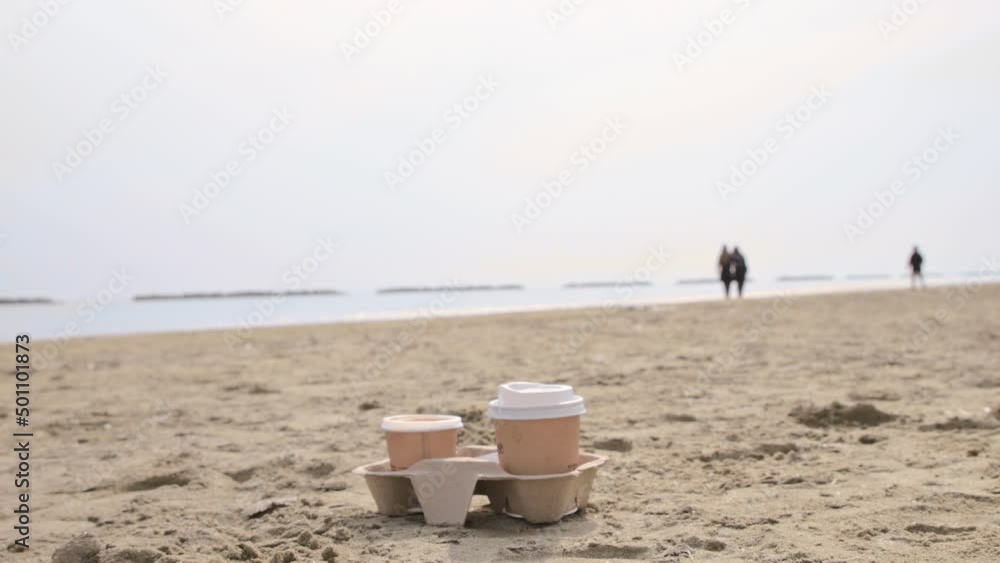 Coffee to go. Coffee break in an open space. Morning coffee on the seashore by the coastline. Peace and tranquility as a time for yourself. High quality 4k footage Coffee to go. Coffee break in an open space. Morning coffee on the seashore by the coastline. Peace and tranquility as a time for yourself. High quality 4k footage