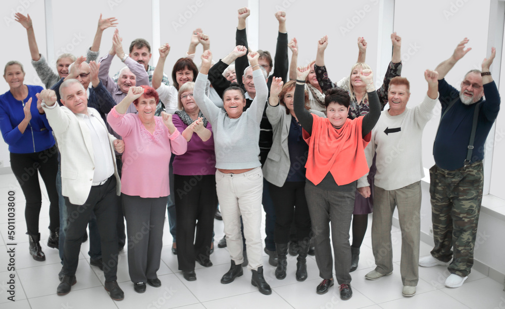 Fototapeta premium Large group of happy people applauding thier team victory