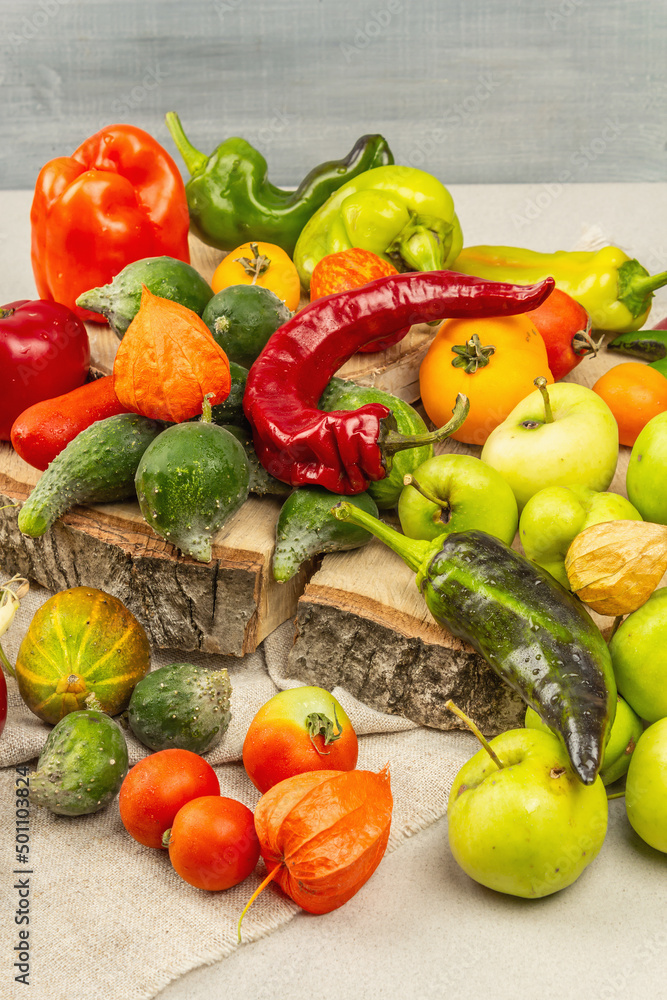 Trendy ugly organic vegetables and fruits on stone concrete background