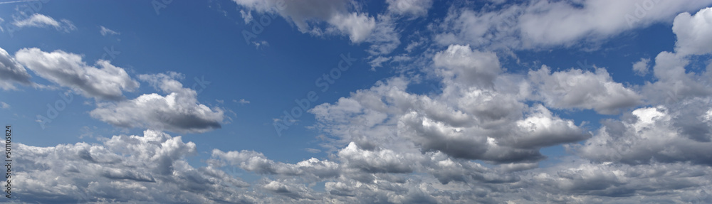 Cumulus clouds illuminated by the rays of the sun float across the sky. Cumulus clouds illuminated by the rays of the sun float across the sky.