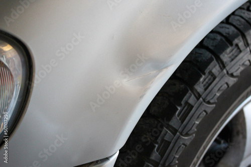 Obraz na plátně Panel damage on a silver SUV
