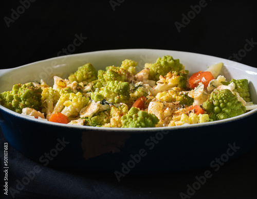 tray with vegetable gratin on dark background
