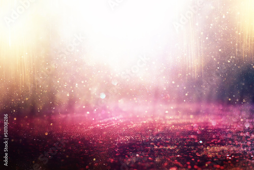background of abstract gold, pink, purple and silver glitter lights. defocused © tomertu