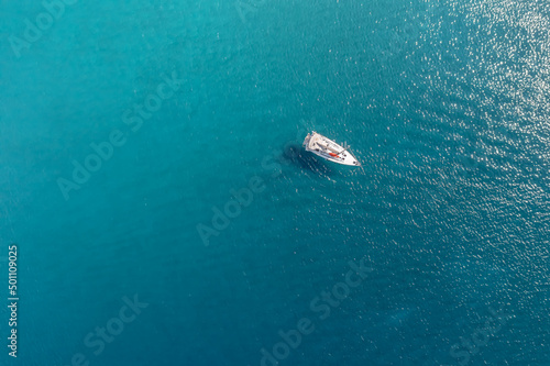 Fototapeta Naklejka Na Ścianę i Meble -  Small yacht at sea, top view