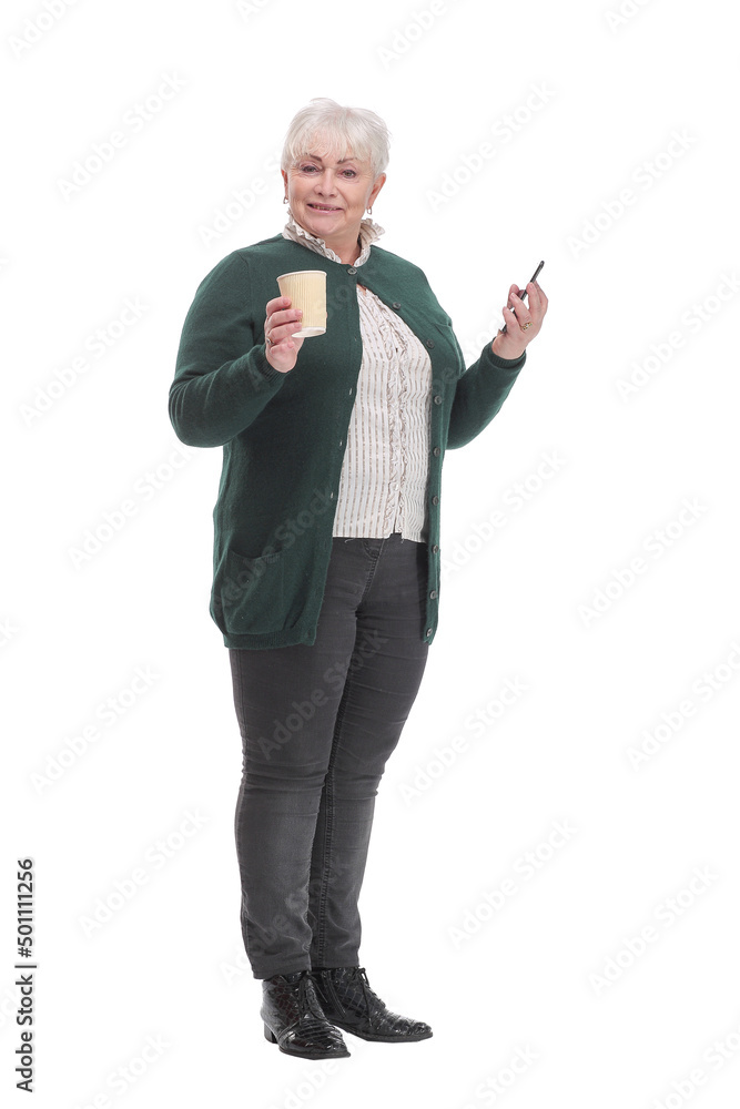 Front view of senior woman with smartphone and coffee. Front view of senior woman with smartphone and coffee.