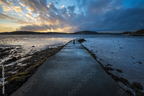 Pier at low tide at sunset, Rockcliffe, Dalbeattie, Dumfries and Galloway, Scotland photo