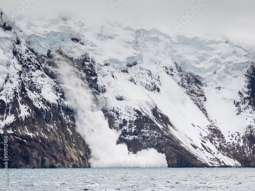 An avalanche of falling ice on Thule Island, a volcanic island in the South Sandwich Islands photo