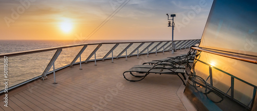 Bild auf Leinwand Cruise ship deck at sunset. Reflection of the sun in the window.