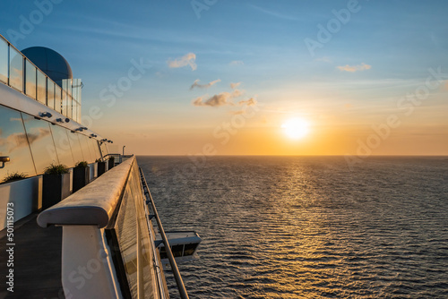 Cruise ship sailing on the Caribbean Sea at sunset. © Nancy Pauwels
