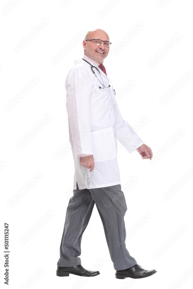Mature doctor with stethoscope walking on white background Mature doctor with stethoscope walking on white background