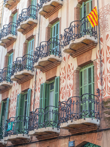 Sgraffito facade of Barcelona building with Catalan flag, Barcelona, Catalonia photo
