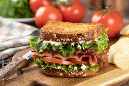 Bacon, lettuce and tomato sandwich on a cutting board