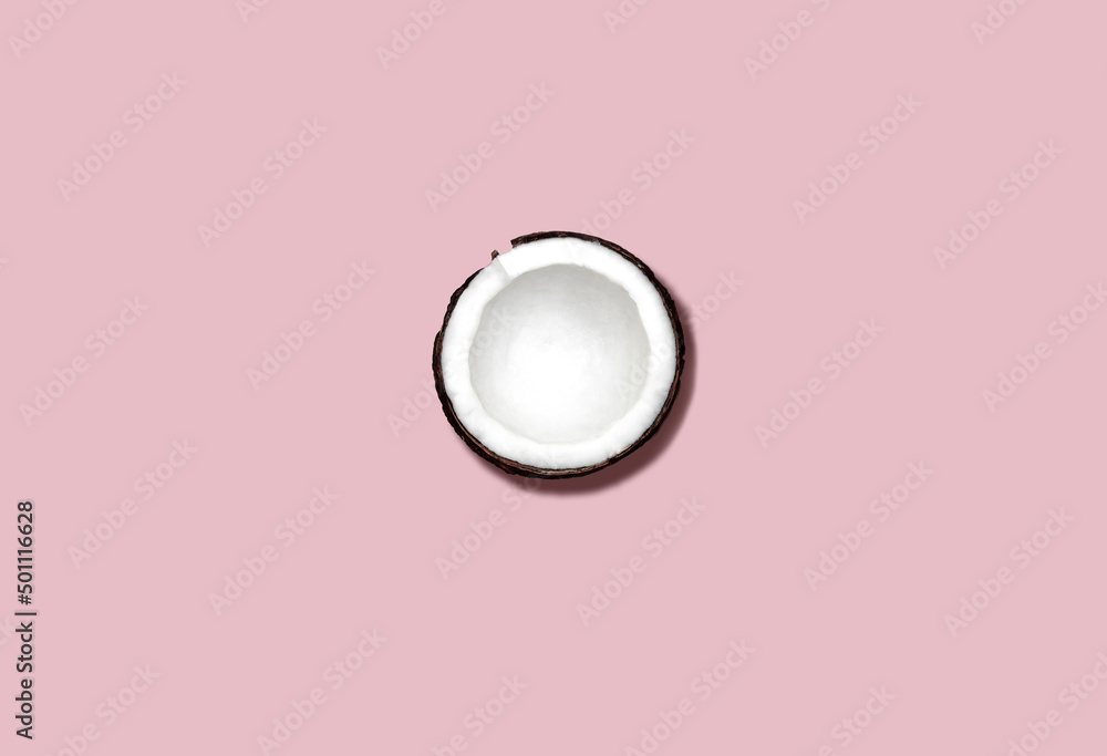 Coconut. Flat lay photo with copy space. Half of fresh coco on pink background Coconut. Flat lay photo with copy space. Half of fresh coco on pink background