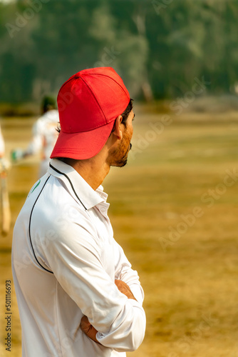 cricket fielder looking to the batsman