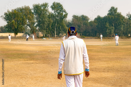 cricket fielder looking to the batsman 