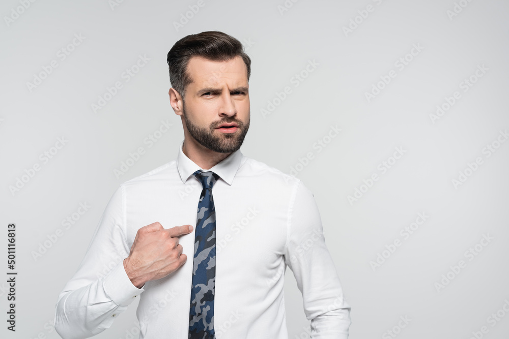 discouraged businessman pointing with finger and himself isolated on grey. discouraged businessman pointing with finger and himself isolated on grey.