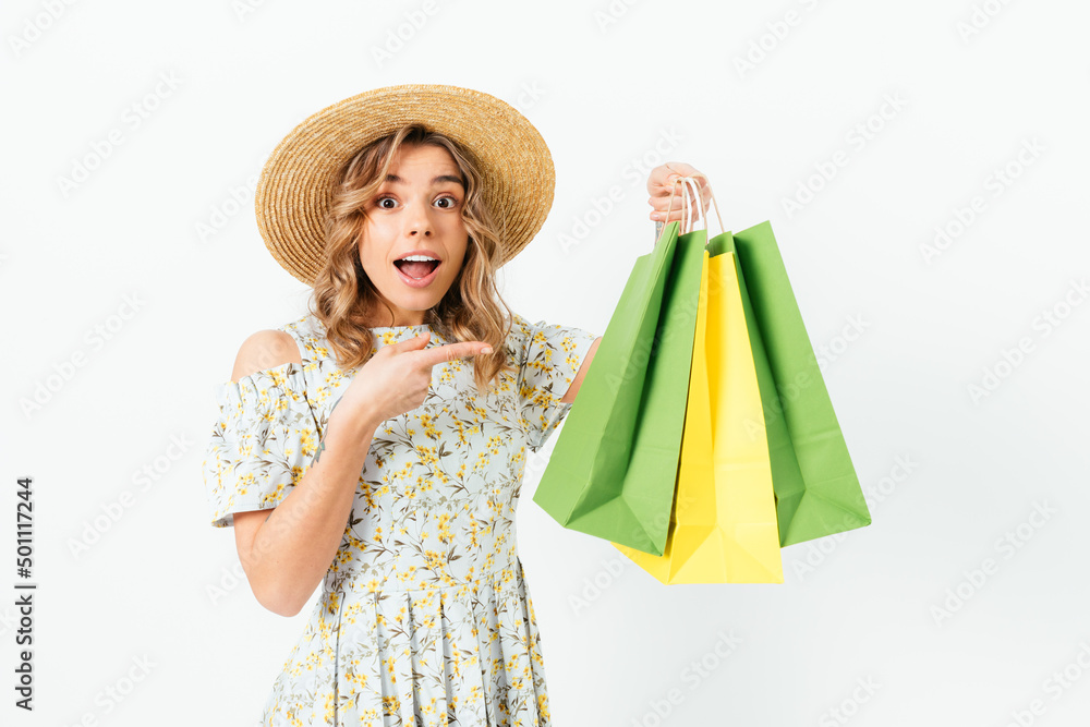 Shocked stylish young woman wearing straw hat and summer dress Shocked stylish young woman wearing straw hat and summer dress