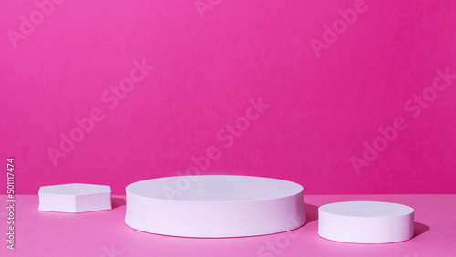 Empty podium or stand for product showcase on pink background photo