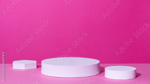 Empty podium or stand for product showcase on pink background