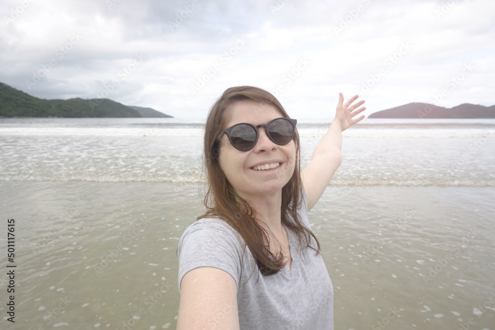 Happy Young Woman Taking a Selfie Portrait. Smilling Woman Tralling to the Beach. Happy Young Woman Taking a Selfie Portrait. Smilling Woman Tralling to the Beach.