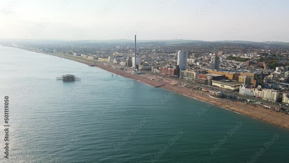 Drone shot of Brighton Palace Pier, with the seafront behind. Aerial shot of the stunning city of Brighton and Hove with seagulls flying around Drone shot of Brighton Palace Pier, with the seafront behind. Aerial shot of the stunning city of Brighton and Hove with seagulls flying around