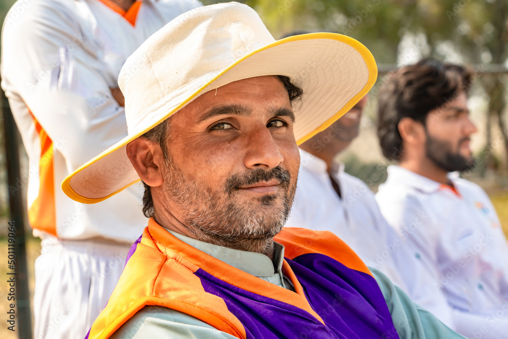 cricket players looking into the camera on match ground cricket players looking into the camera on match ground