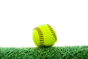 green softball on grass with white background