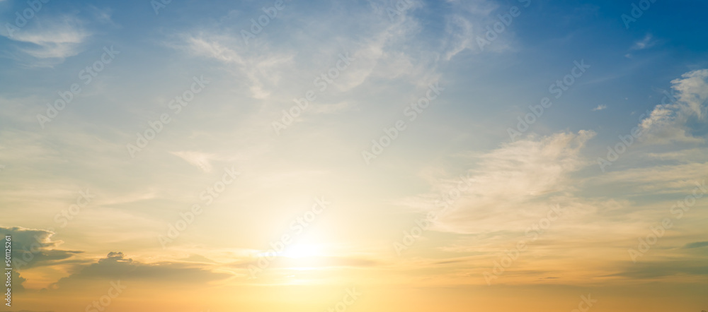 Sunset sky clouds with orange, yellow sunlight clouds in the evening, beautiful sunrise sky background in summer season
