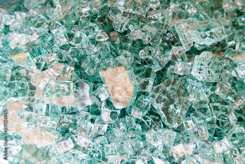 Fotografija Surface full of broken tempered glass shards, broken green tempered glass