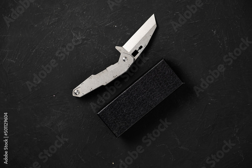 sharp pocketknife on a black background © ROCOCO2018