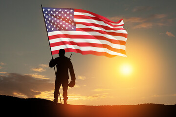 Silhouettes of soldier with USA flag against the backdrop of a sunset. Greeting card for Veterans Day, Memorial Day, Independence Day. USA celebration. Patriotism, protection, remember honor.
