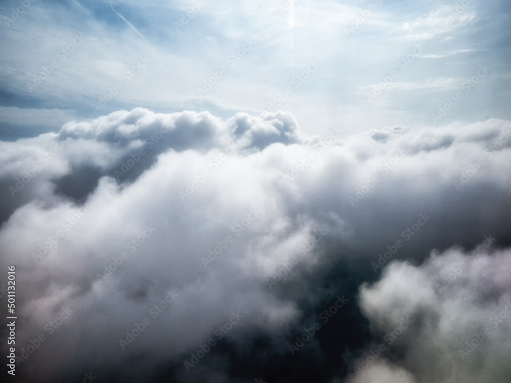 Fluffy white clouds from above Fluffy white clouds from above