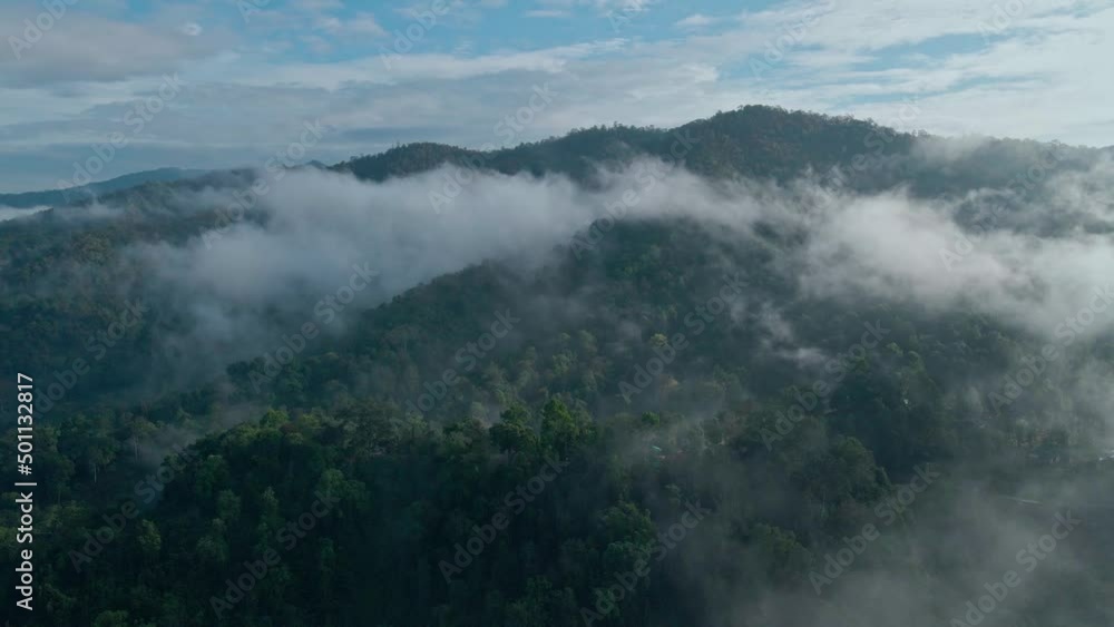 Aerial view landscape fog covers the mountains in the morning Aerial view landscape fog covers the mountains in the morning