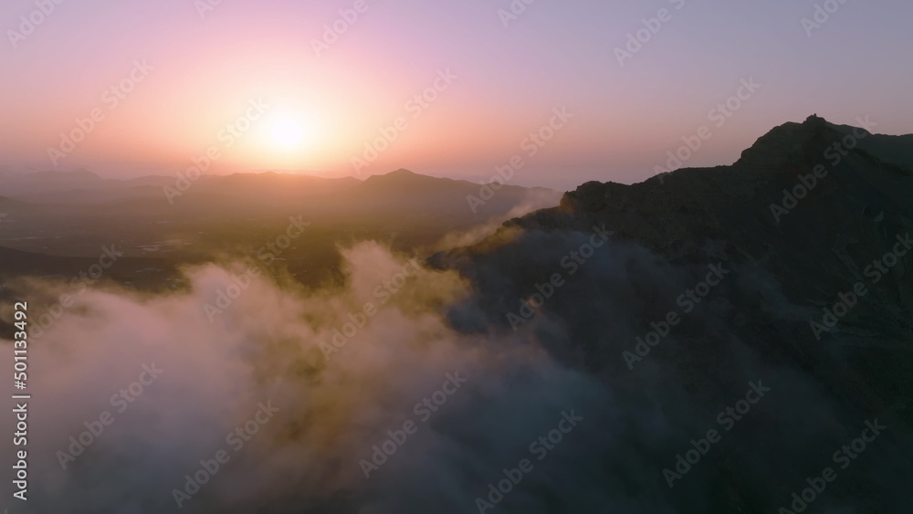 Top view of the sunrise over the mountains. Aerial view of Fuerteventura island