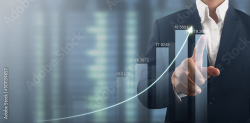 Hand touching  graphs of financial indicator market analysis chart