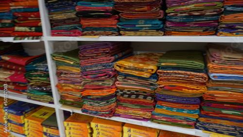 Wallpaper Mural Colorful sarees or saris are arrange on racks and display in a retail shop, for use as indian textiles background. Torontodigital.ca