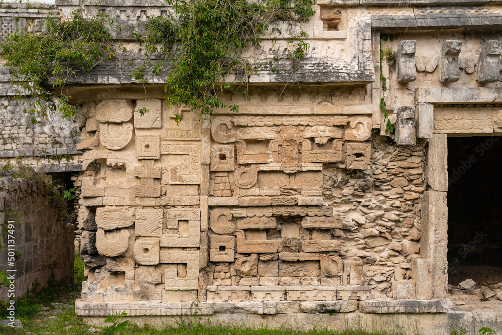 Element with bas-relief ornaments of temple at Chichen Itza built by the Maya people of the Terminal Classic period in Tinúm Municipality, Yucatán State, Mexico 