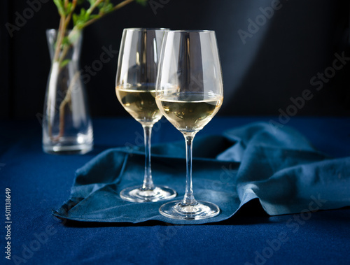 Two Glasses of White Wine on Blue