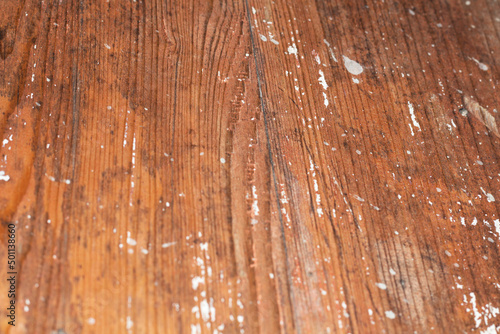 Texture of lacquered wooden surface with white paint splashes and blur