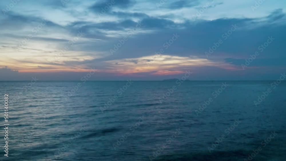 Time lapse of Majestic sunset or sunrise landscape at the sea. Amazing light of nature cloudscape sky and Clouds moving away rolling colorful dark sunset clouds. Nature environment background Time lapse of Majestic sunset or sunrise landscape at the sea. Amazing light of nature cloudscape sky and Clouds moving away rolling colorful dark sunset clouds. Nature environment background