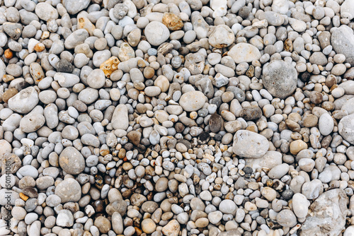 There are a lot of stones on the beach.