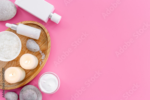White cosmetic products with bottle and tube, top view