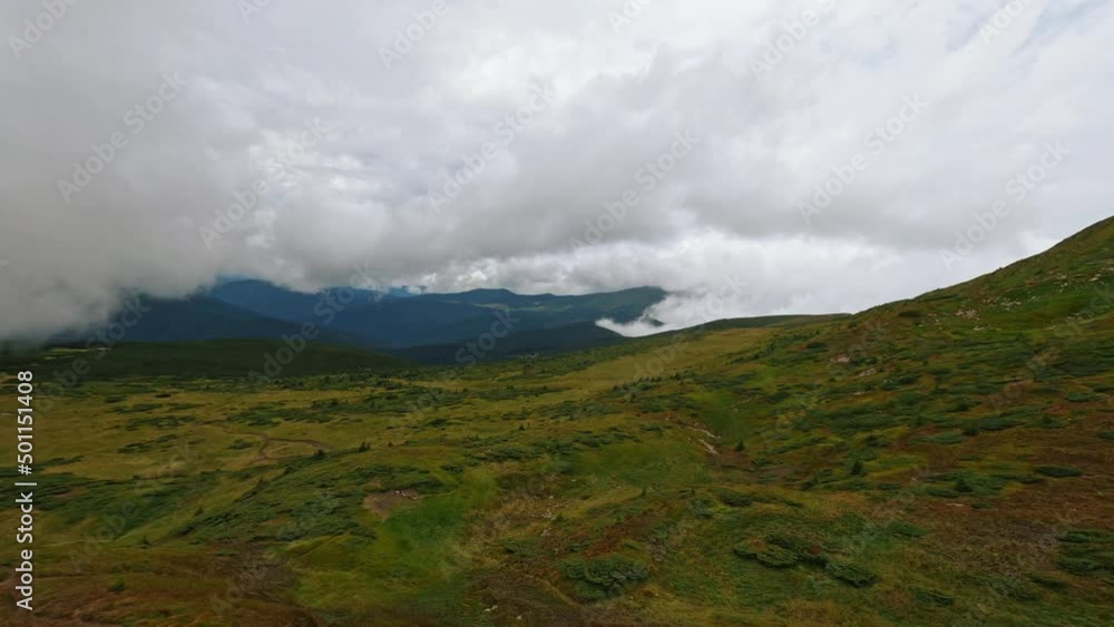Top aerial view flight over the mountains. Ukrainian Carpathians. Beautiful landscape. Cloudy Top aerial view flight over the mountains. Ukrainian Carpathians. Beautiful landscape. Cloudy