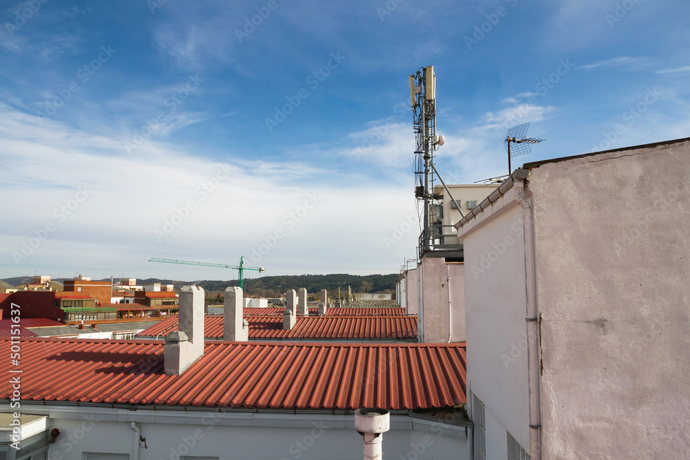 Mobile phone booth and antennas  on the roof of the building  
