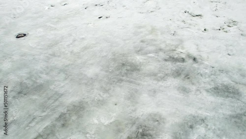 top down view of northern frozen sea ocean ice jams on a sunny day and beach with sand. High quality 4k footage