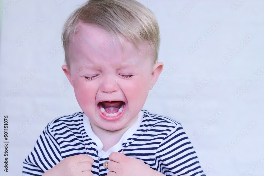 Defocused sad baby. Cry little child. Brush your teeth. Funny lifestyle. Copy space - concept of children's oral hygiene, caries treatment, dentistry, stomatologist, healthcare Defocused sad baby. Cry little child. Brush your teeth. Funny lifestyle. Copy space - concept of children's oral hygiene, caries treatment, dentistry, stomatologist, healthcare