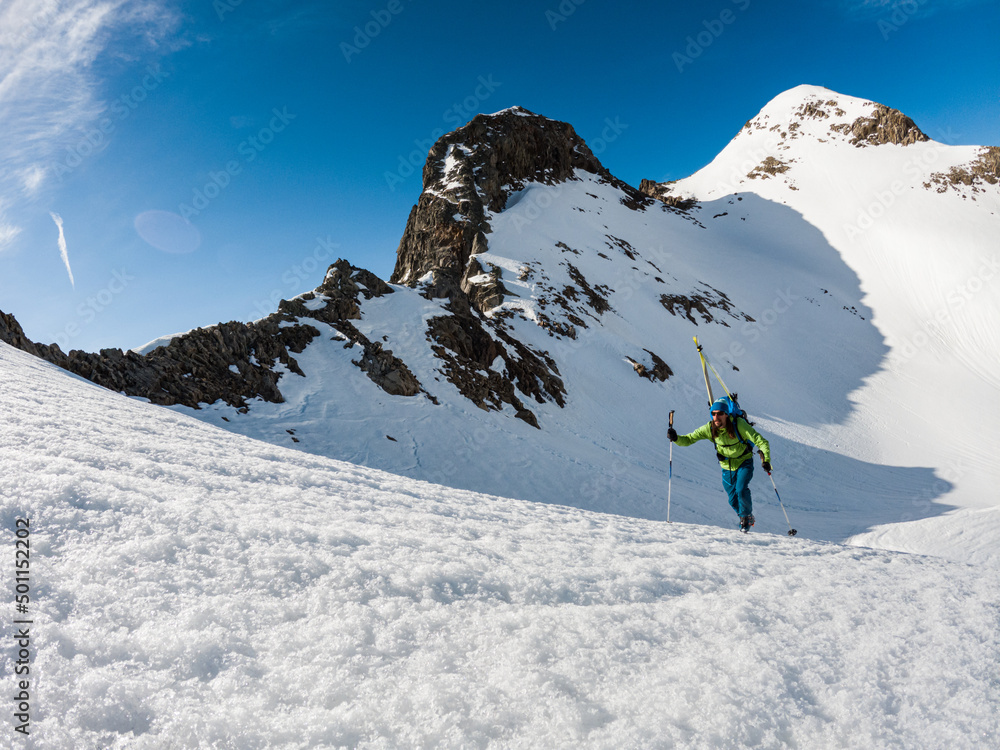 A man climbing up a mountain in the Alps