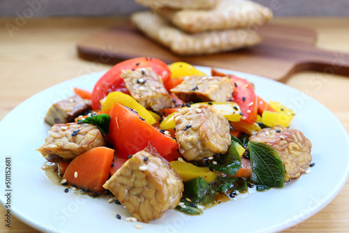 Colorful vegetables salad with roasted Tempeh cubes for whole foods plant-based diet