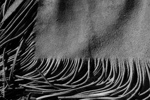 Fringe texture of leather armitas for western lifestyle background.