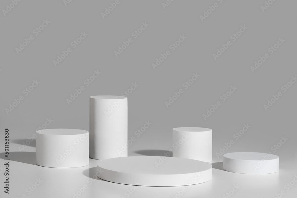 Podium mockup with five cylinders on gray background Podium mockup with five cylinders on gray background